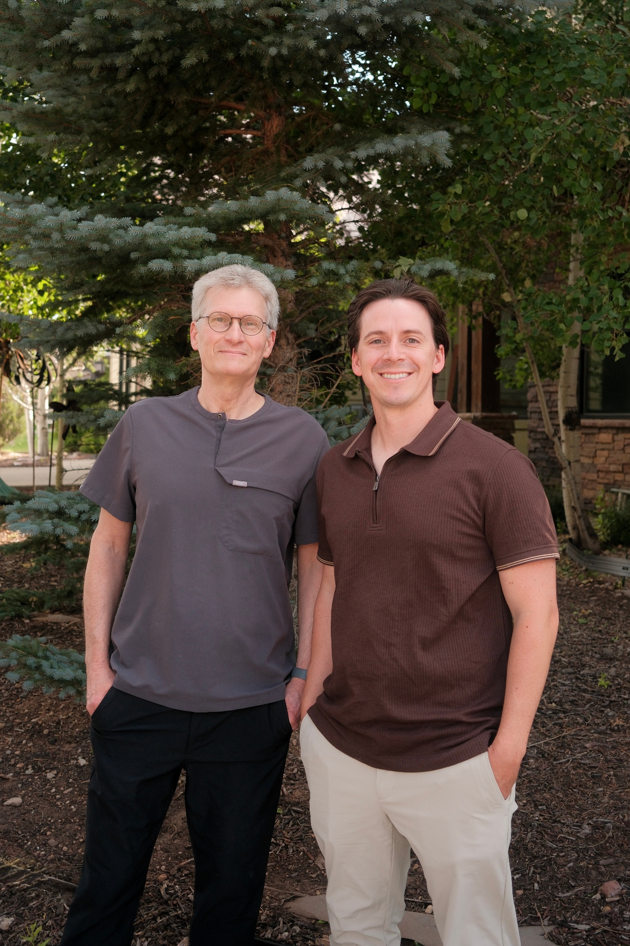 Dr. Paul Innis, DMD and Dr. Jeremy Adams, DMD standing together outside the Park City practice